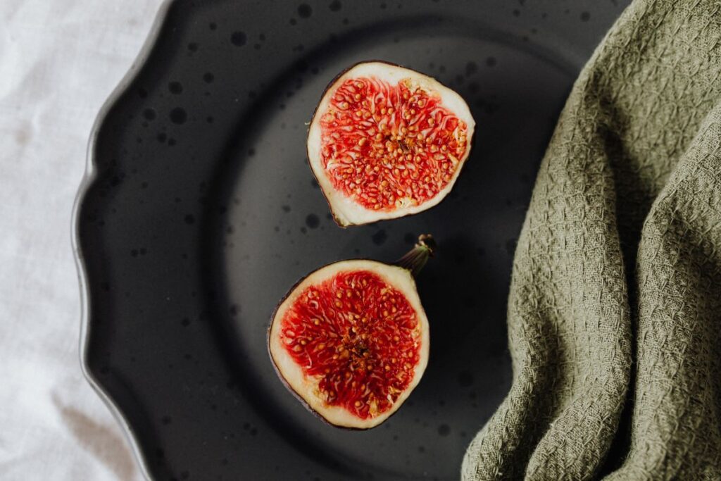 Fruits on a black stoneware plate Stock Free