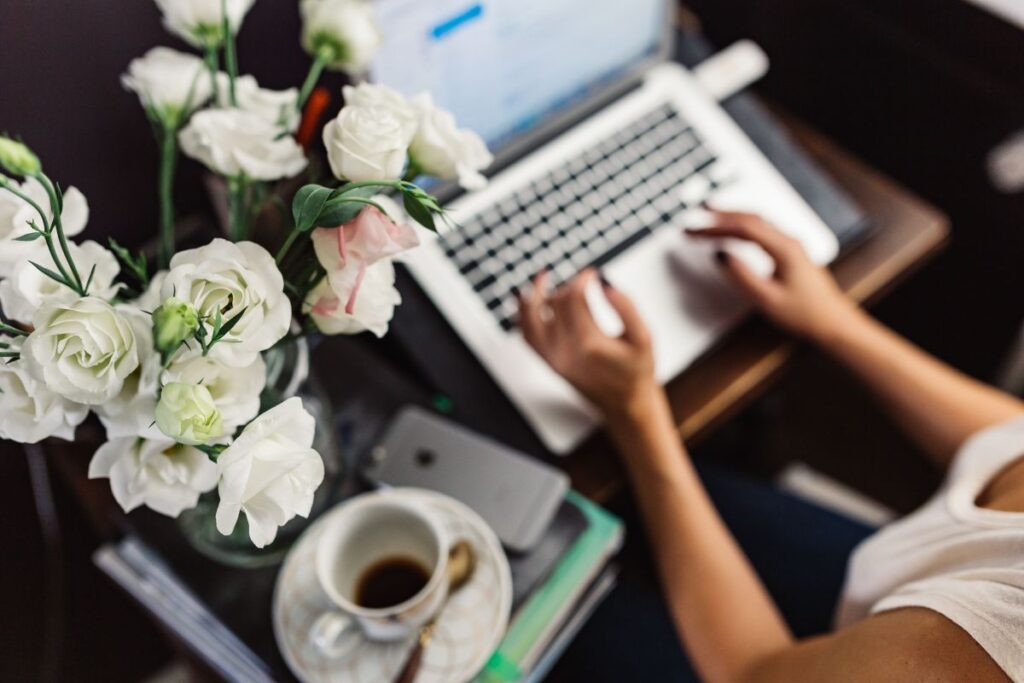 Woman working on laptop at home office Stock Free