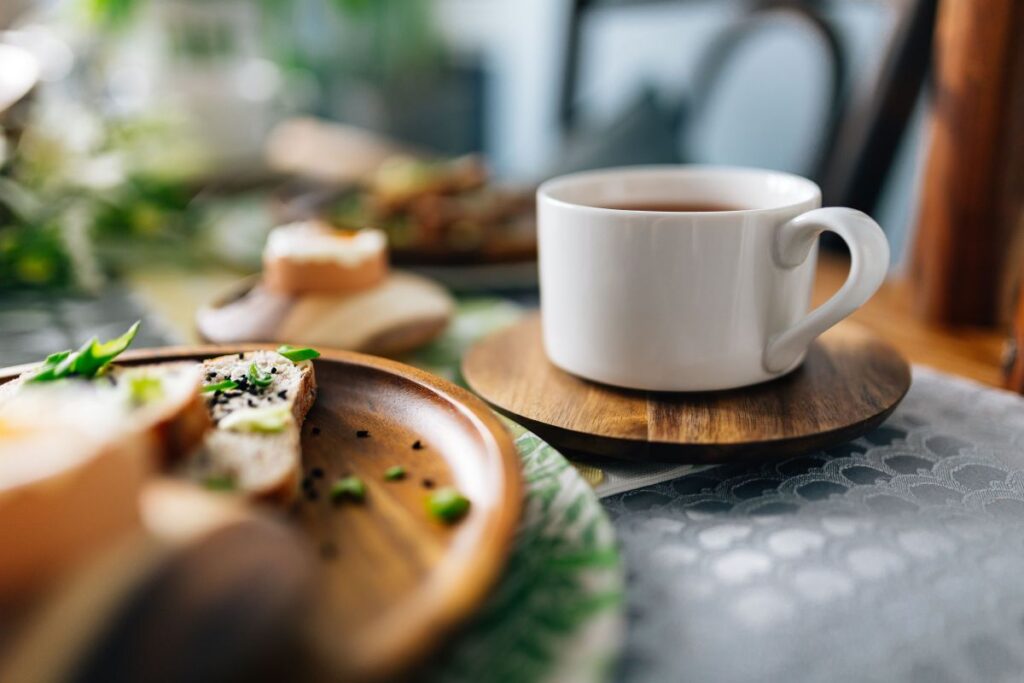 Breakfast served with tea, bread and eggs Stock Free