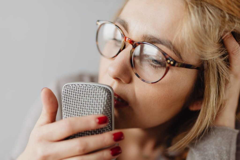 Woman Recording ASMR Sounds On Microphone Stock Free