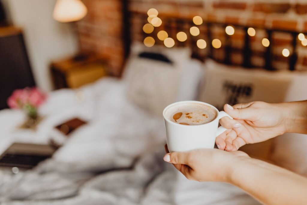 Morning coffee in bed. Working in bed Stock Free