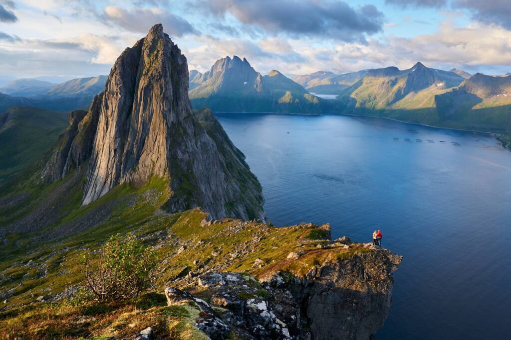 A Couple Looking at the Segla Mountain Free Photo