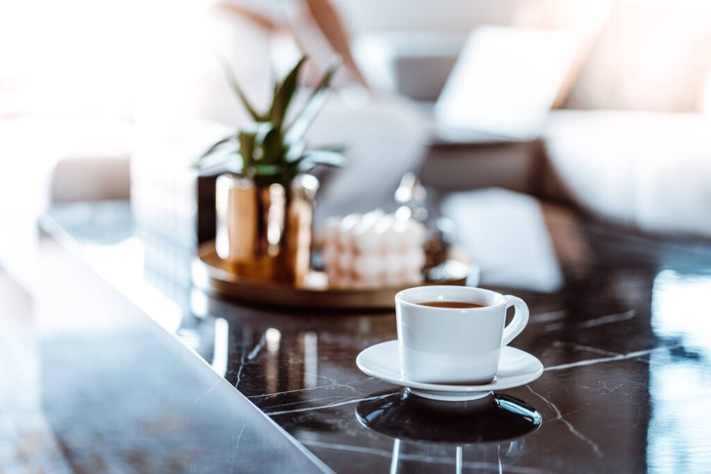 A Cup of Coffee on a Black Marble Table Free Photo