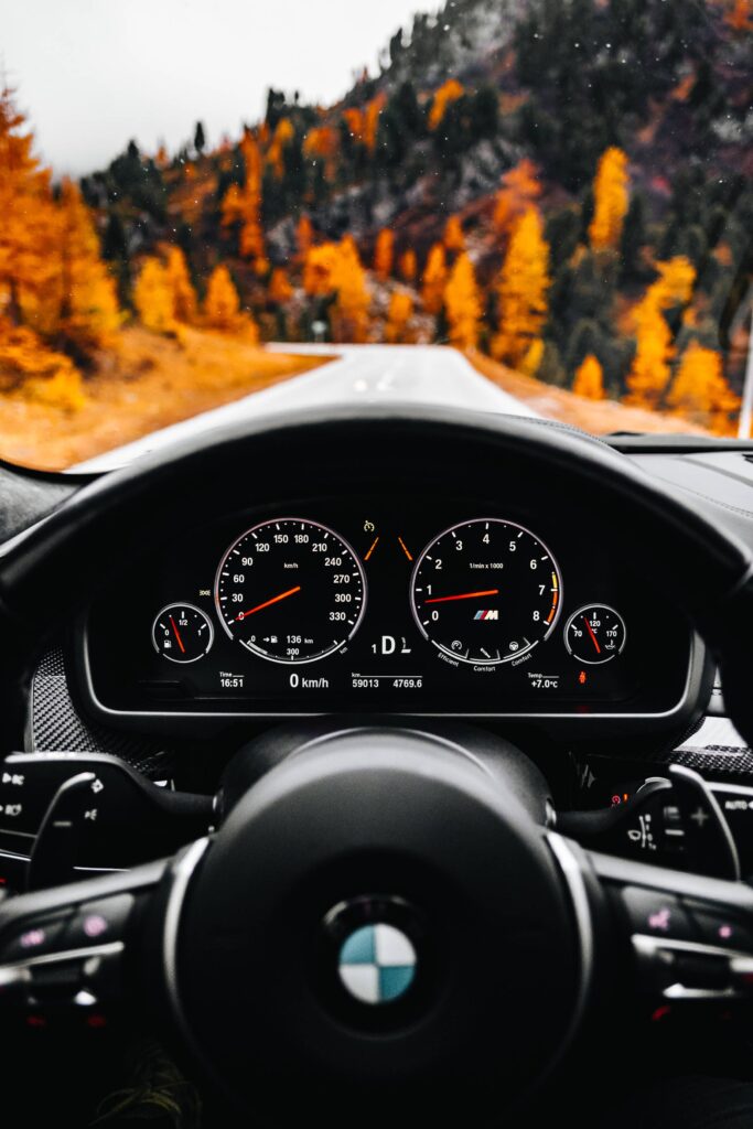 A View from The Driver’s Angle to an Autumn Road Free Photo