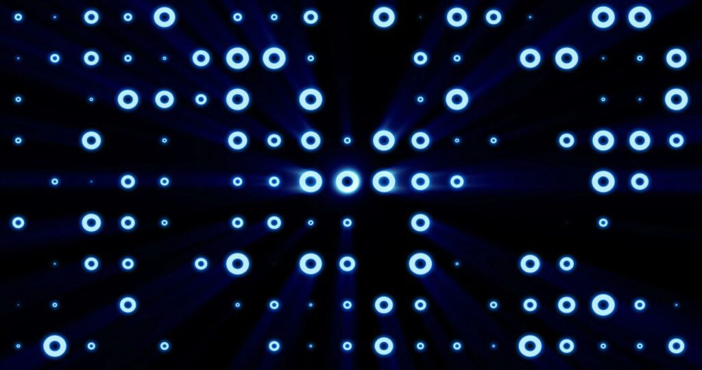 Abstract background of bright blue glowing light bulbs from circles and dots of energy magic disco wall Stock Free