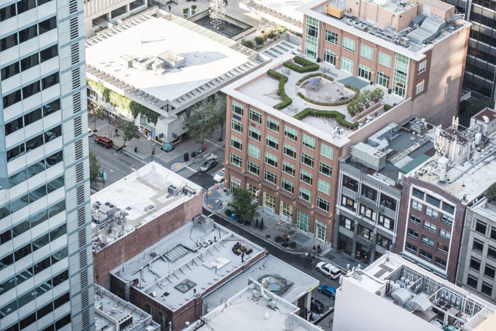 Aerial Close Up View of City Streets and Buildings Free Photo