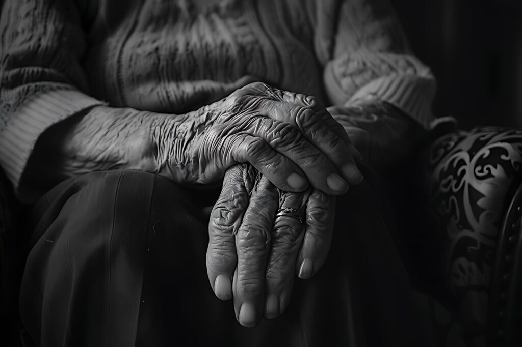 A black and white image of an elderly person’s hand is full of stories and the passage of time Free Photo