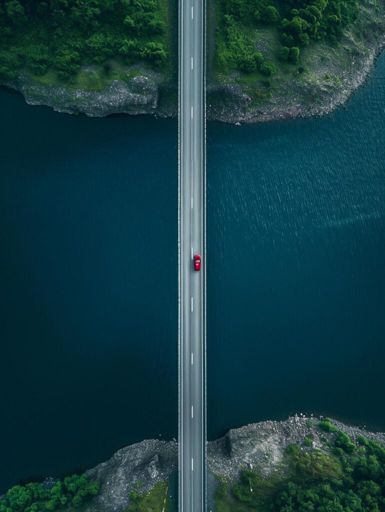 aerial view captures long bridge that stretches across dark blue body of water Ai Generated Free Photo