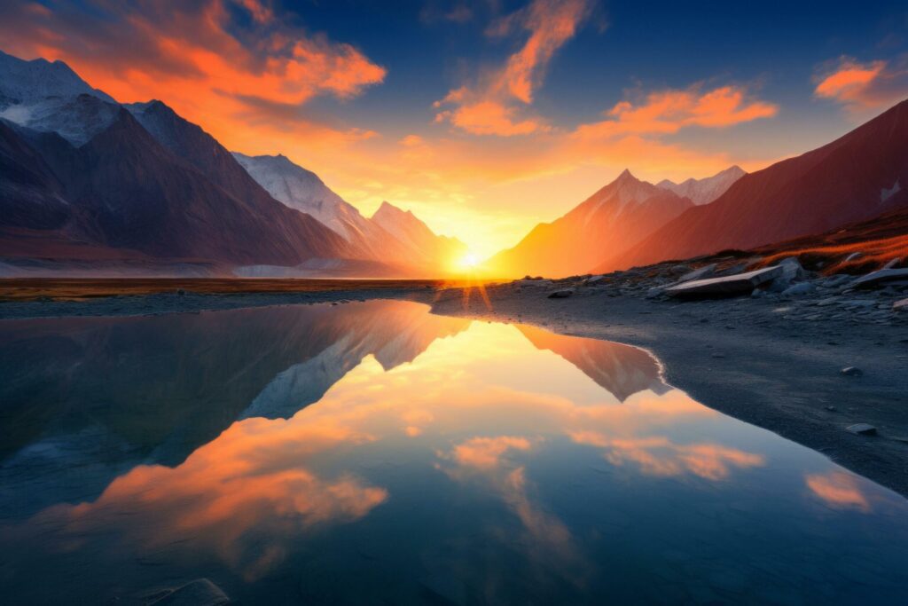 beautiful landscape with high mountains with illuminated peaks stones in lake reflection Free Photo