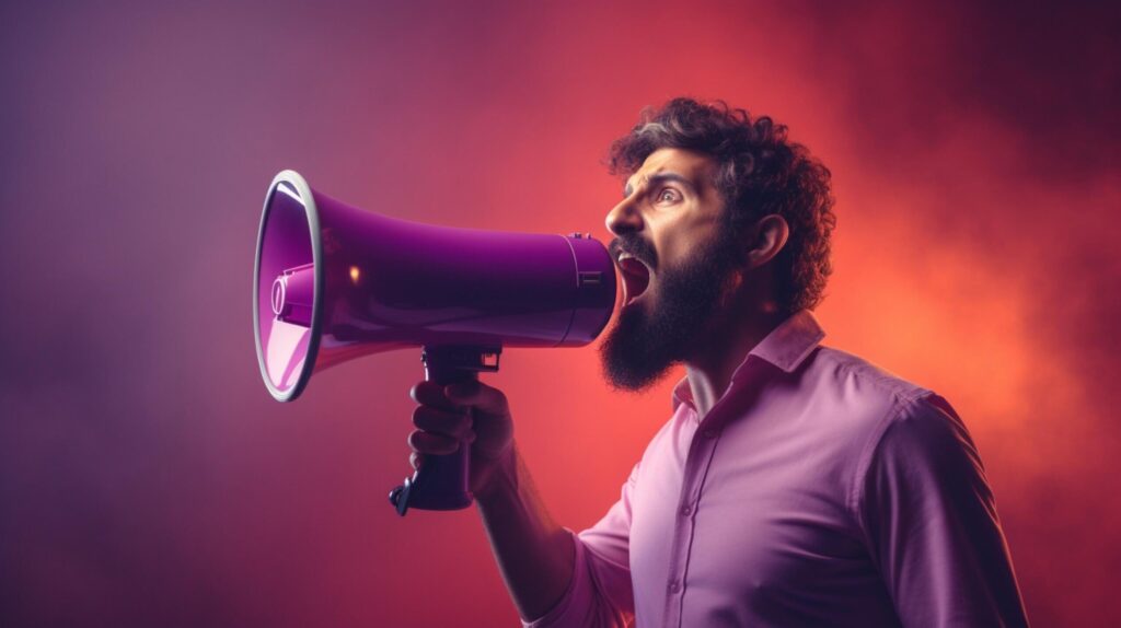 man holding megaphone standing on Plum background Free Photo