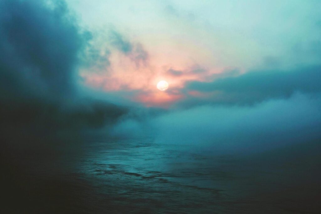 Sunset on the sea in the fog. Long exposure photo. Free Photo