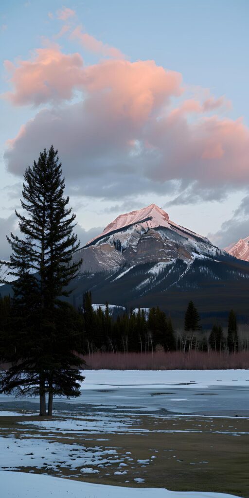 Sunset Over Snowy Peaks Free Photo