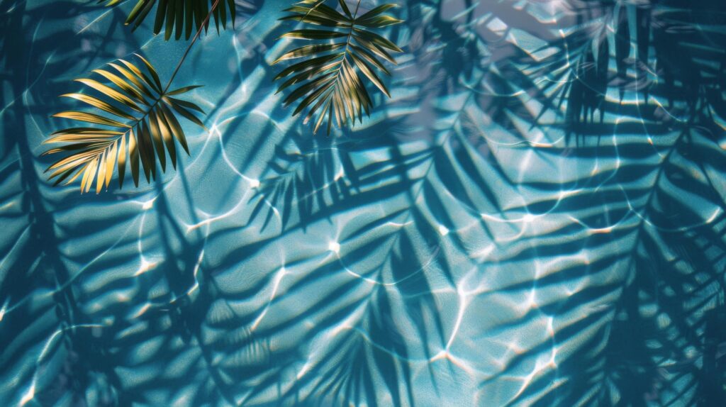 Tropical Pool With Palm Trees and Blue Water Free Photo