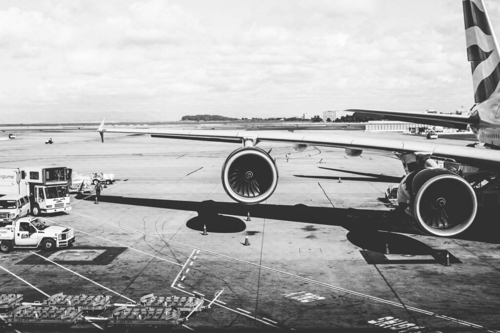 Airplane Wing with Jet Engines at the Airport Free Photo