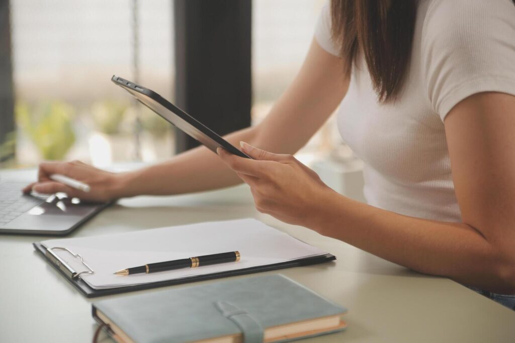 Asian businesswoman working on laptop computer Look for job online, freelance looking and typing on notebook on table, lifestyle of woman studying online Stock Free