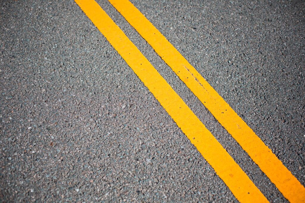 Asphalt Road with Yellow Road Lines Free Photo