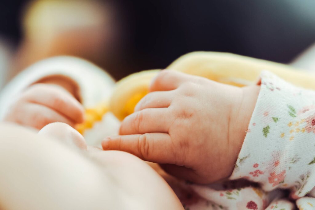 Baby Playing with Yellow Toy Free Photo