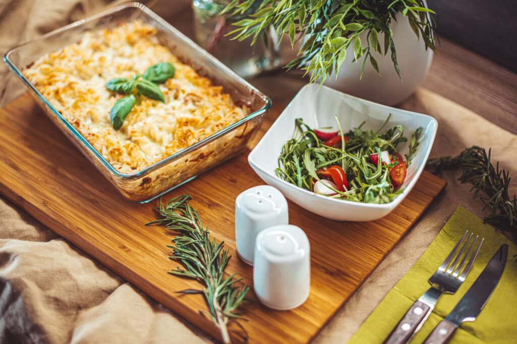 Baked Pasta with Tuna Served on a Wooden Chopping Board Free Photo