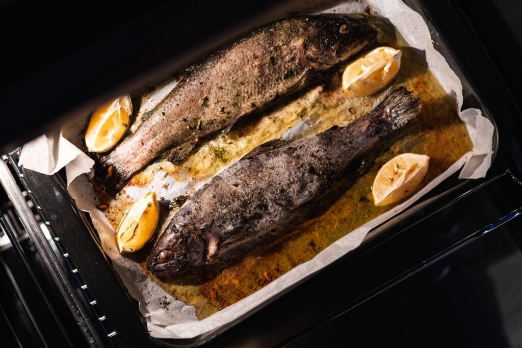 Baked Trout on Butter and Herbs with Lemon Free Photo