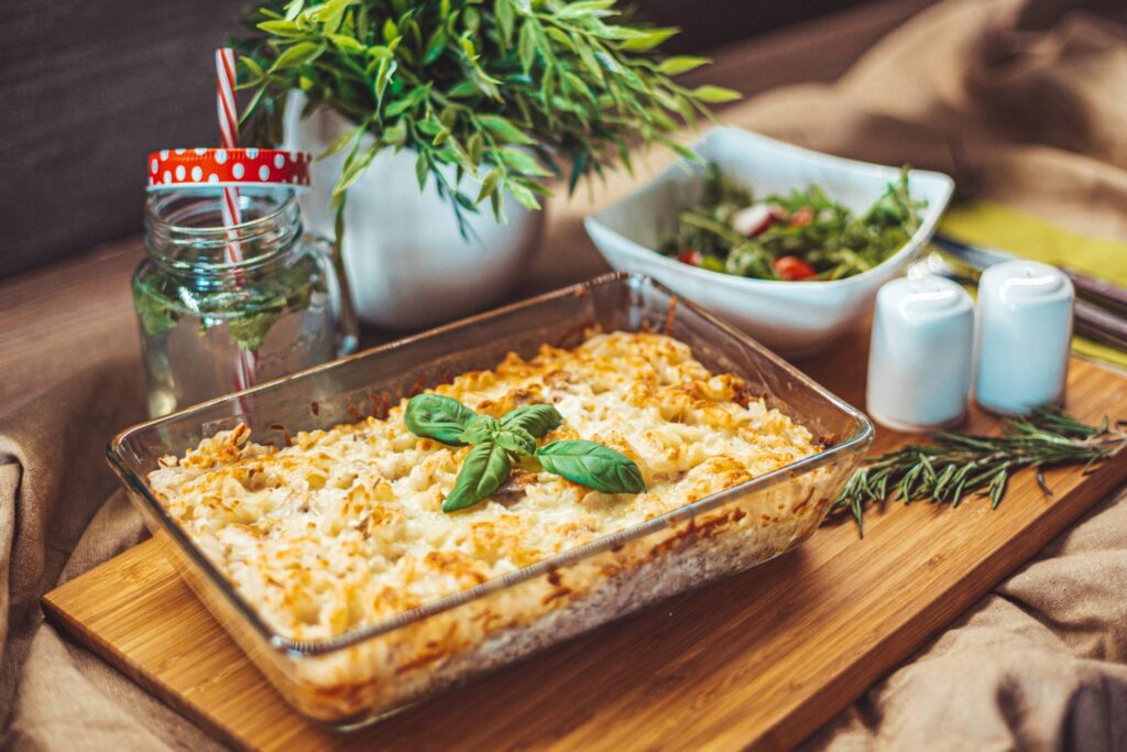 Baked Tuna Pasta Served on a Wooden Plate Free Photo