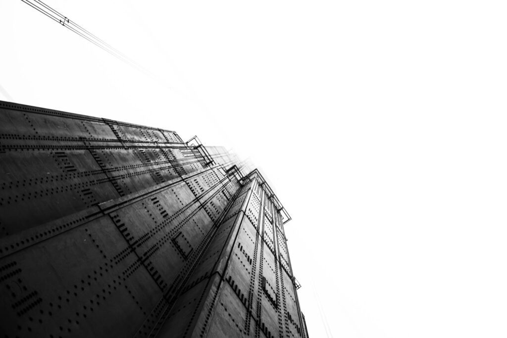 B&W Golden Gate Bridge Pillar Against Foggy Sky Free Photo