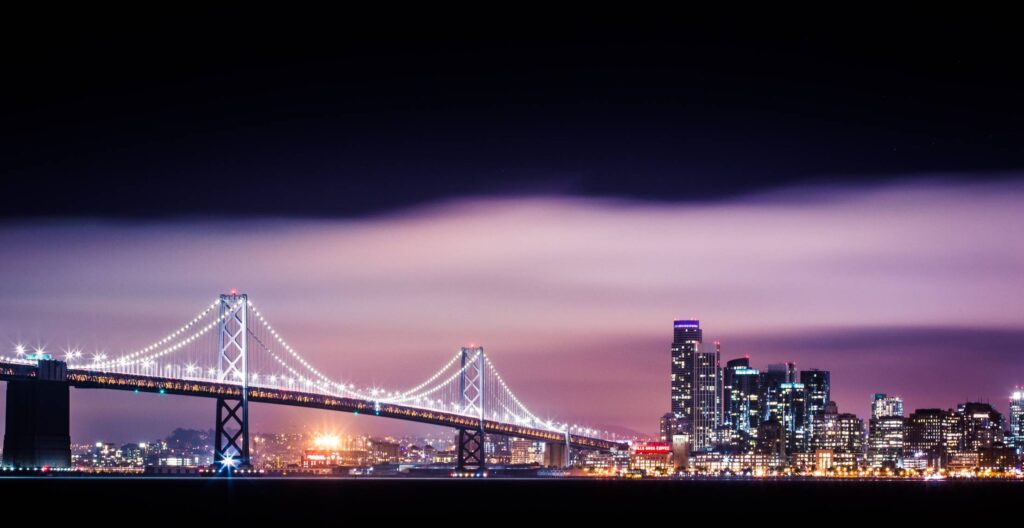 Bay Bridge with San Francisco Skyscrapers Cityscape at Night Free Photo