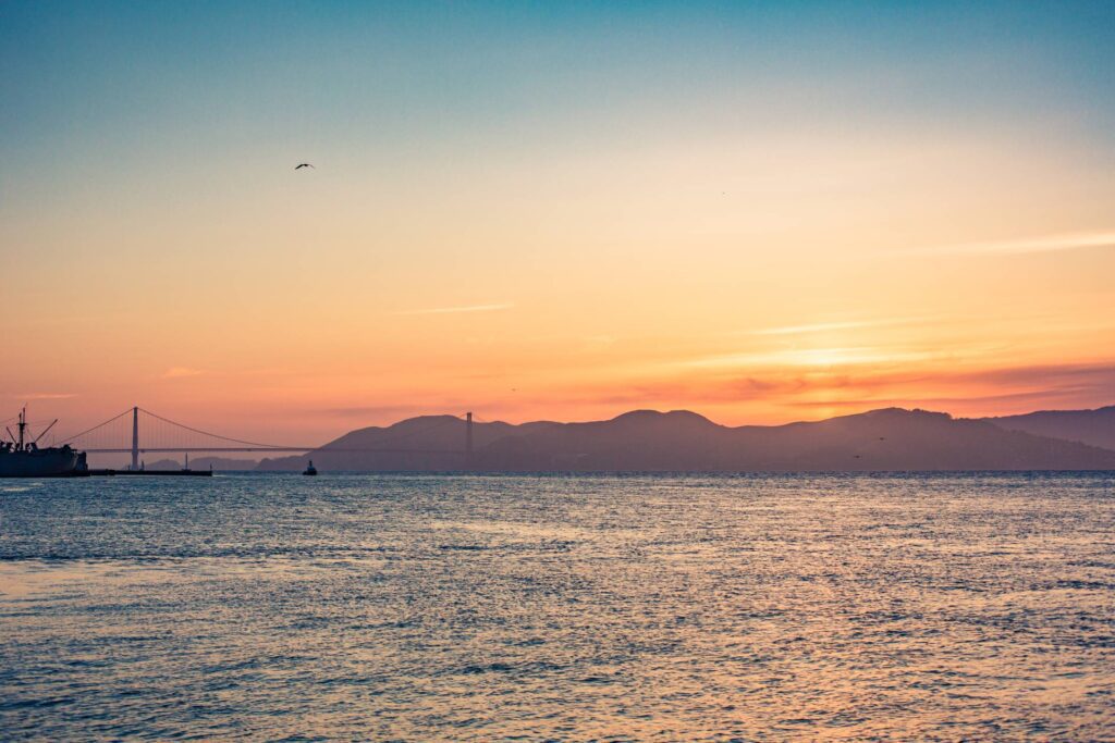 Beautiful Colorful Sunset with Ocean and Golden Gate Bridge Free Photo