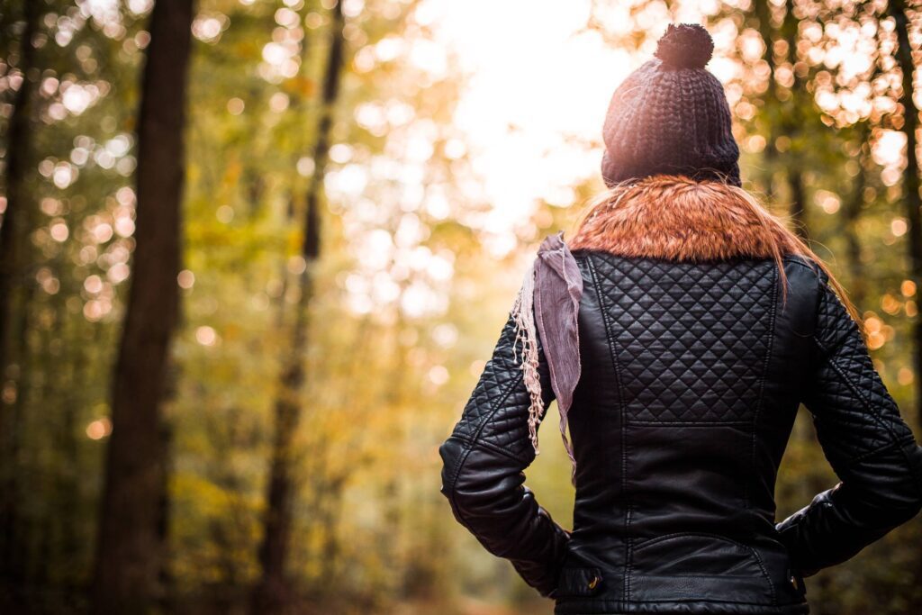 Beautiful Girl in Forest Turning Her Back Free Photo