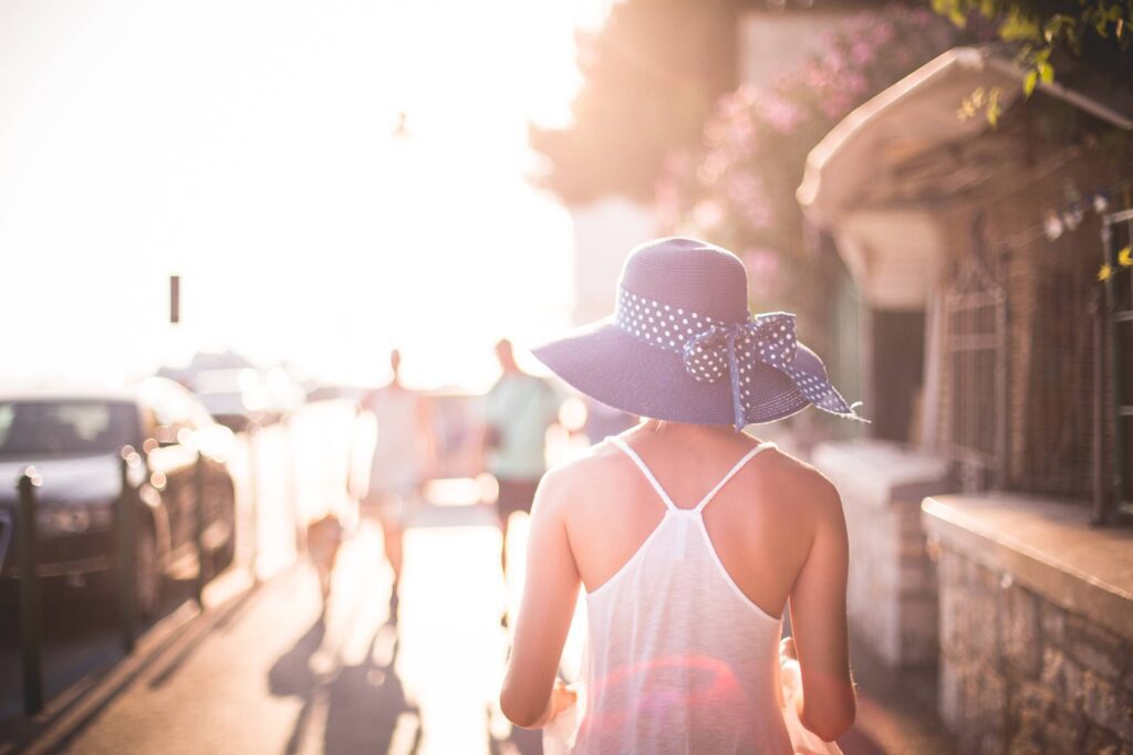 Beautiful Girl with Hat in Sun Free Photo