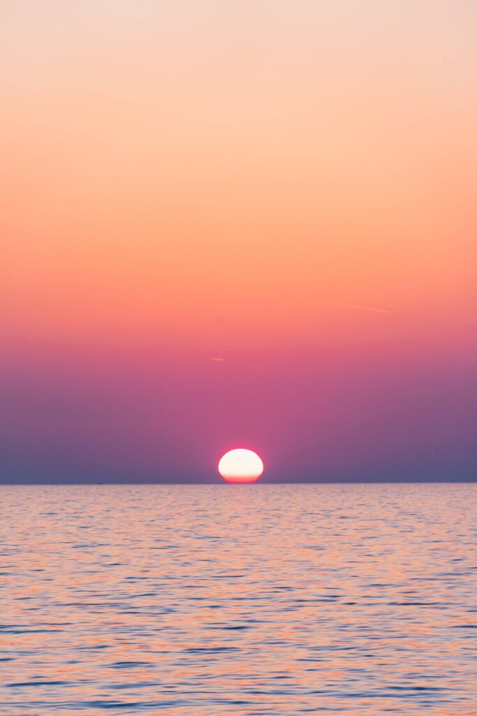 Beautiful Sunset Above the Sea with Golden & Violet Sky Free Photo