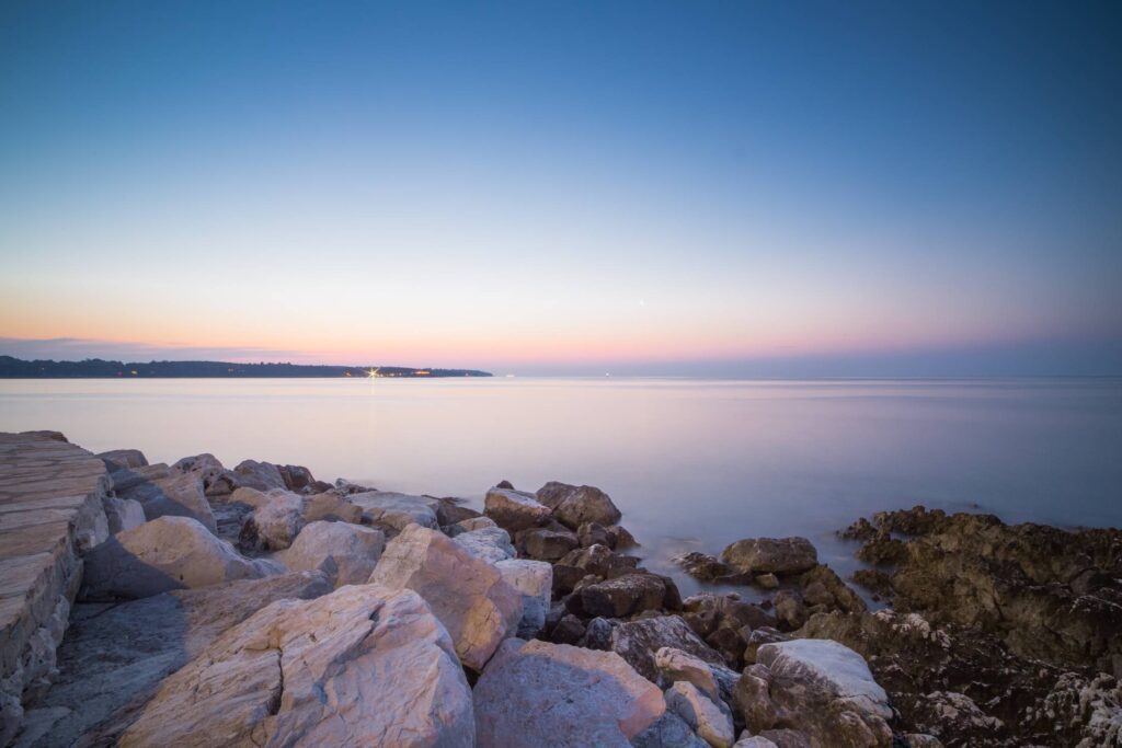 Beautiful Sunset Over Seaside Rocks Free Photo