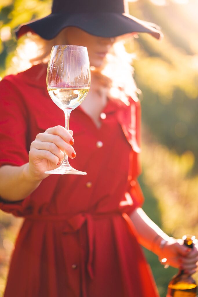 Beautiful Woman Holding a Glass of Wine Free Photo