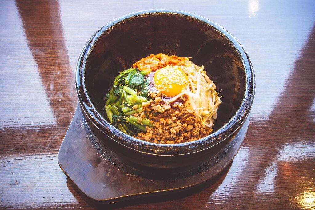 Bibimbap in a heated stone bowl, Korean food Stock Free