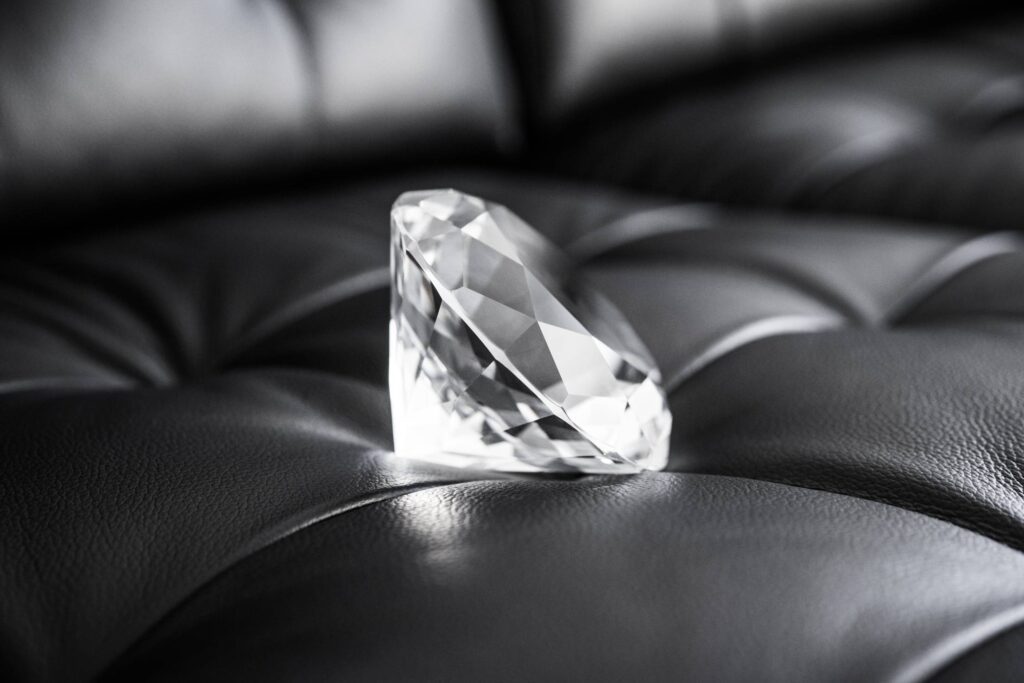 Big Glass Diamond Crystal on Black Leather Sofa Free Photo