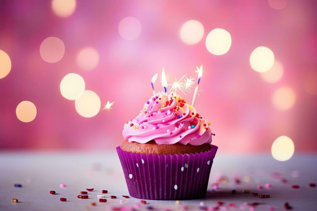 Birthday cupcake with burning candle on bokeh lights background, Birthday cupcake with candles on pink background with bokeh, AI Generated Stock Free