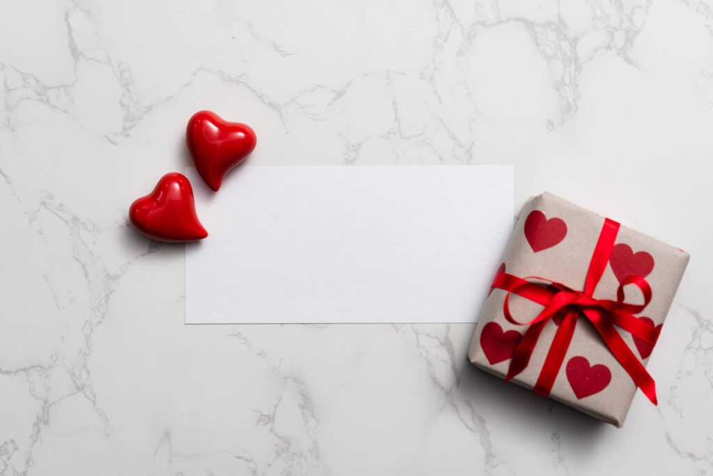 Blank Card Love Letter on White Marble Background Free Photo