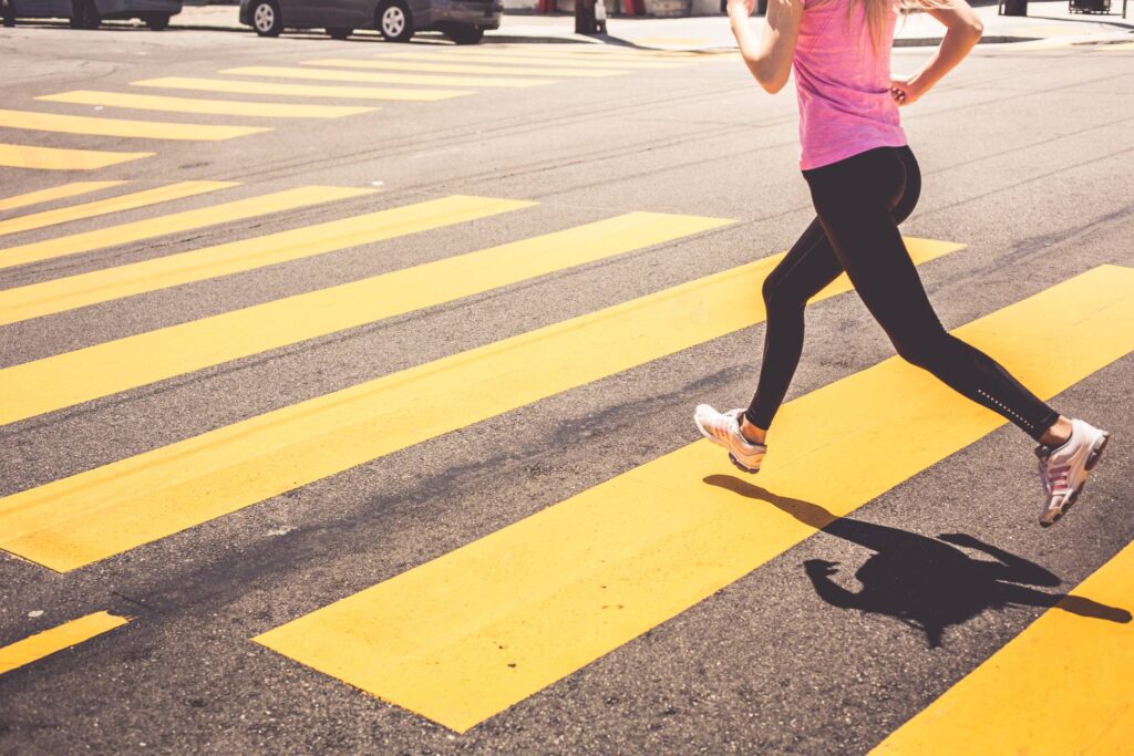 Blonde Woman Running Over The Pedestrian Crossing Free Photo