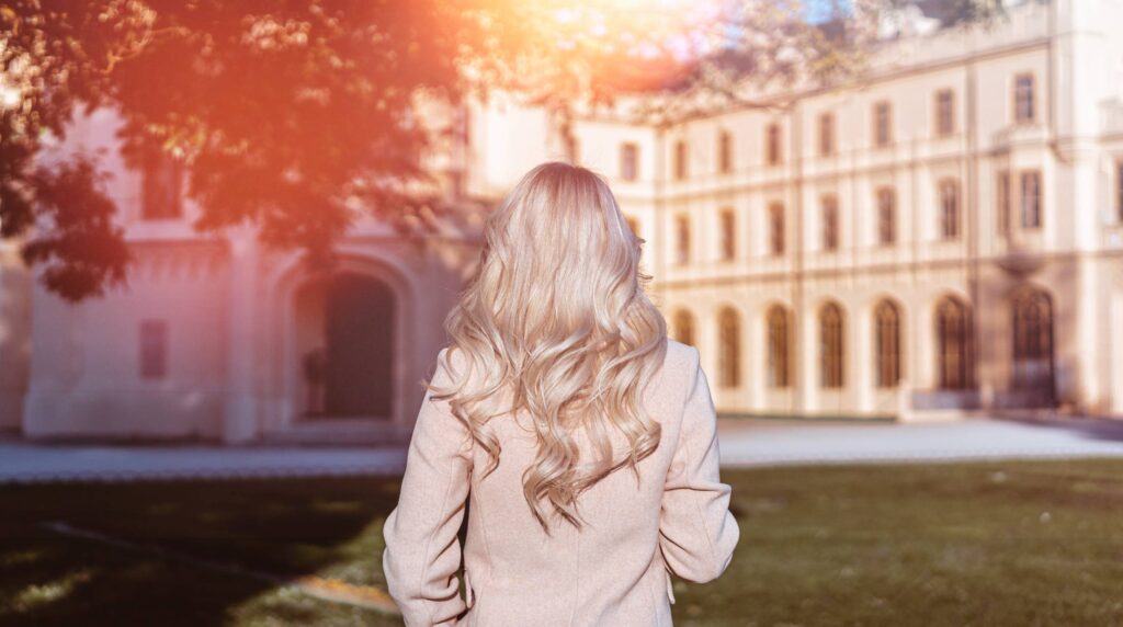 Blonde Woman Standing in front of Lednice Castle in South Moravia Free Photo