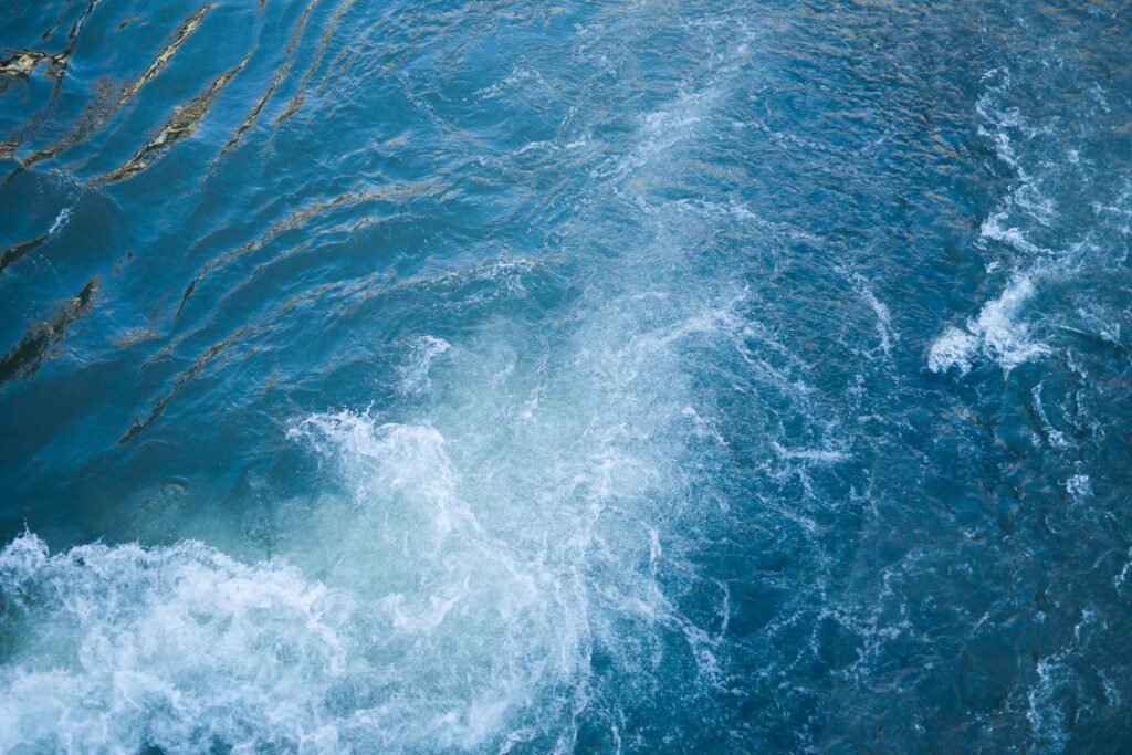 Blue Sea Waves Behind The Boat Free Photo