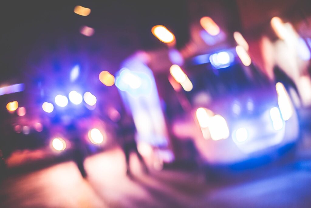 Blurred Emergency Cars At Night Free Photo