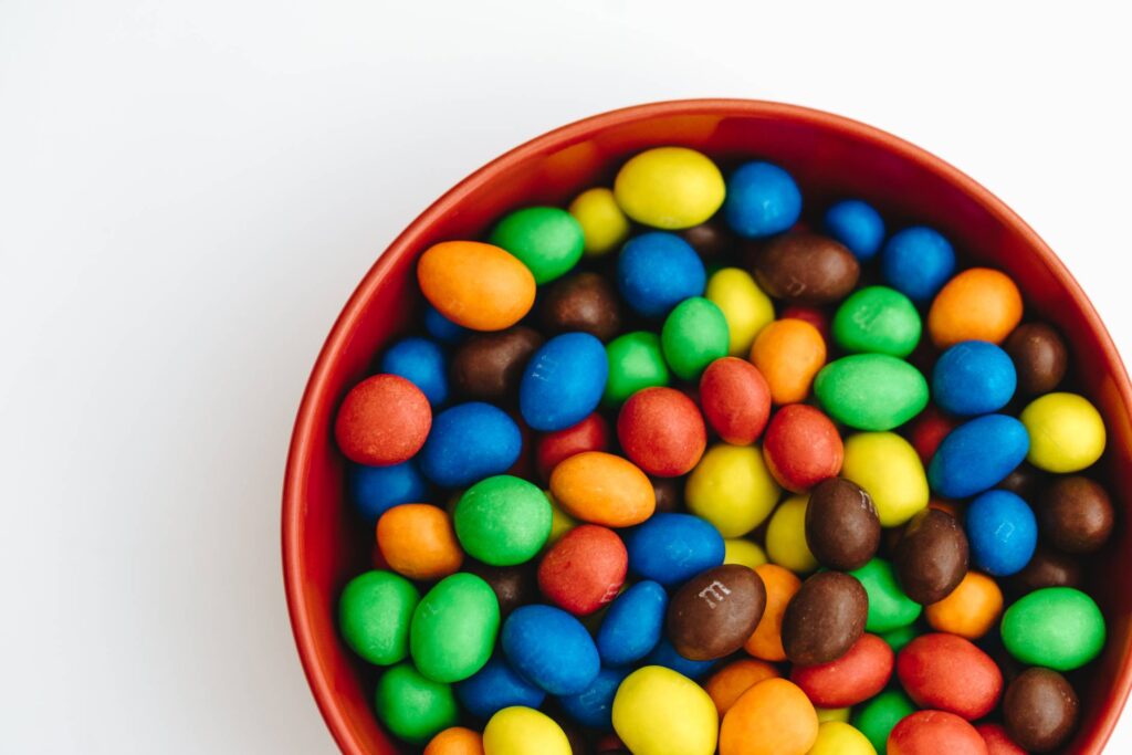 Bowl Full of Colorful Peanut Chocolates Free Photo