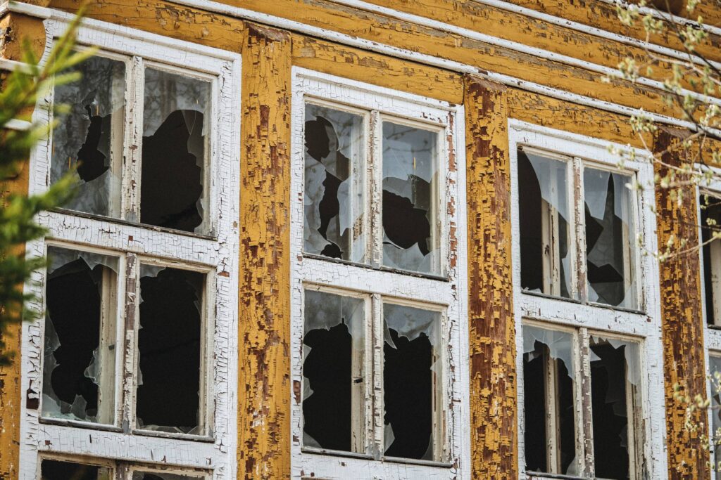 Broken Windows in an Old Abandoned Building Free Photo