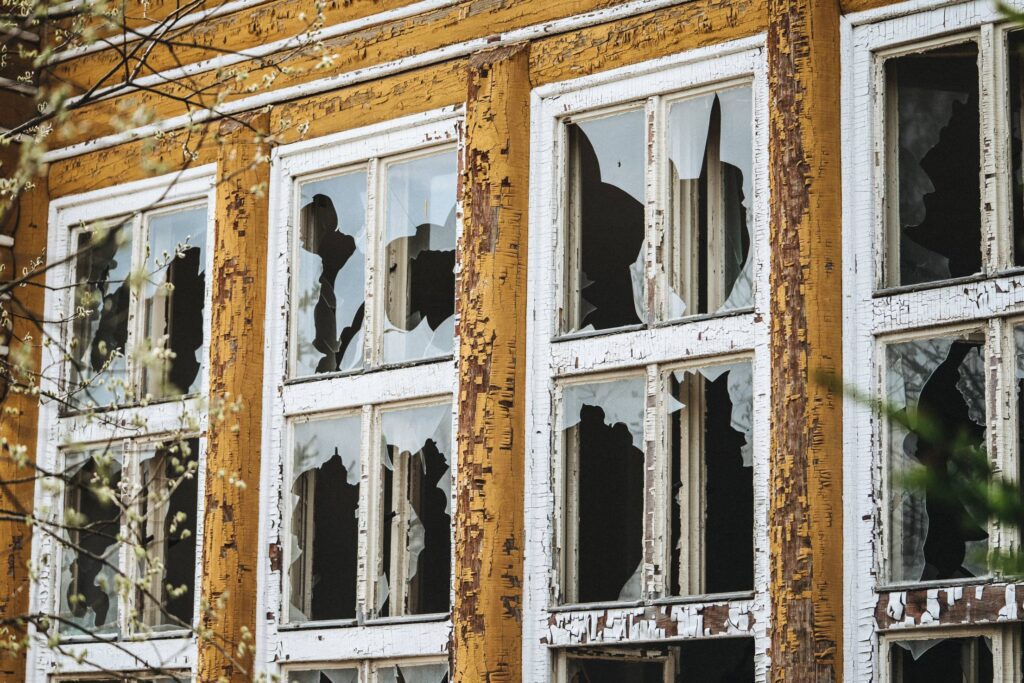 Broken Windows in an Old Dilapidated Building Free Photo