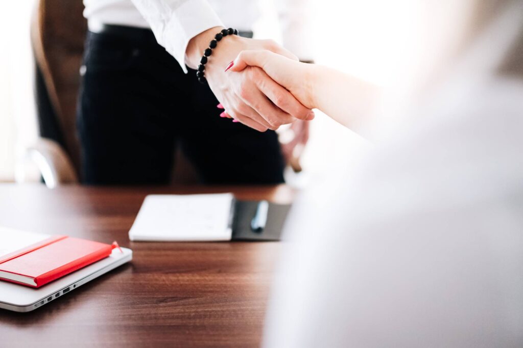 Business Man and Woman Handshake in Work Office Free Photo