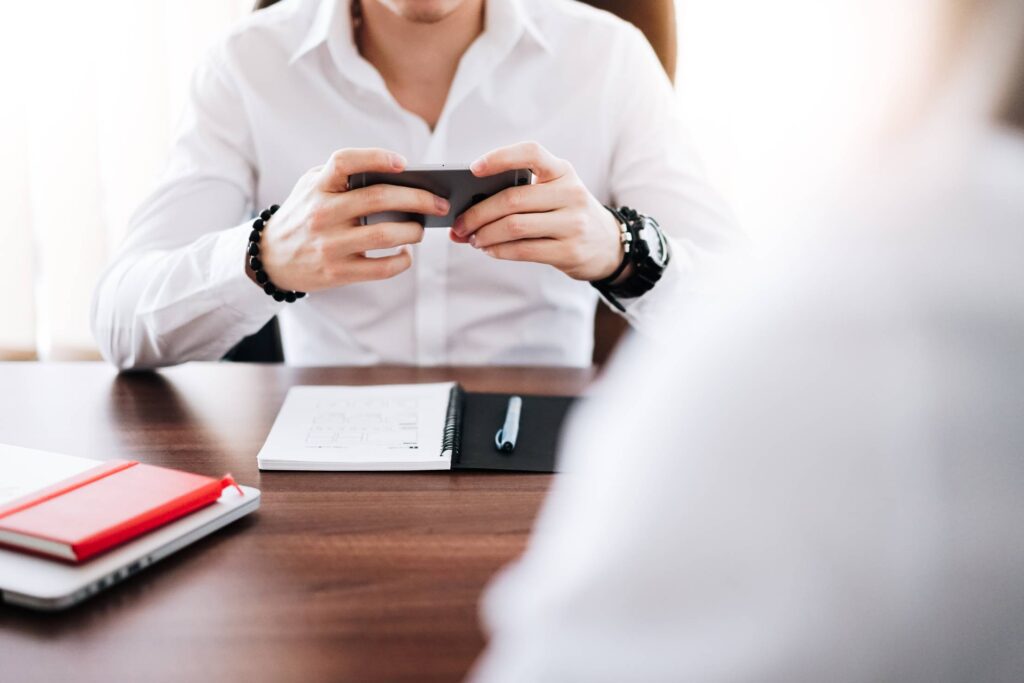 Business Man Working on His Smartphone in The Office Free Photo