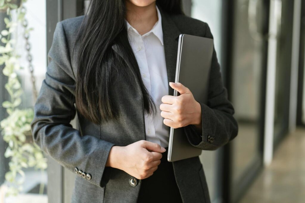 business woman holding laptop computer in office office Stock Free