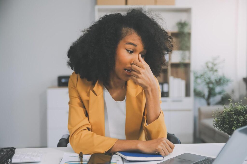 Business women are stressed while working on laptop, Tired asian businesswoman with headache at office, feeling sick at work, copy space Stock Free