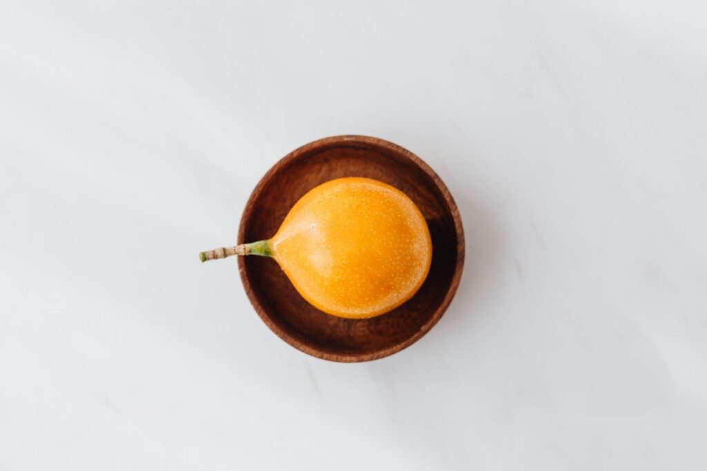 Passion fruit on the white table Stock Free