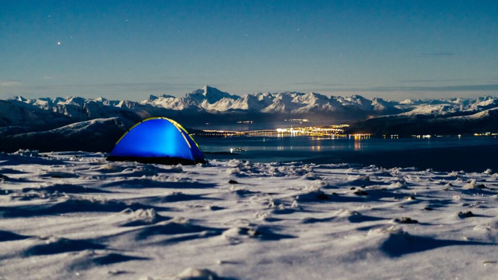 Camping Place on Snowy Mountain with Fjord View Free Photo