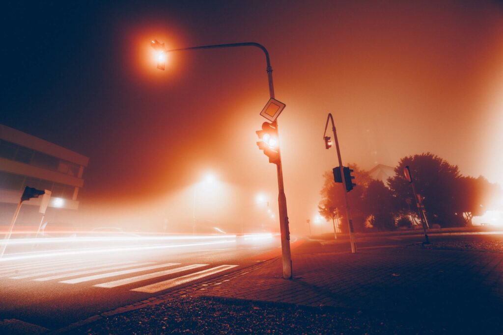 Car Lights & Crossroad Traffic Lights in The Fog Free Photo